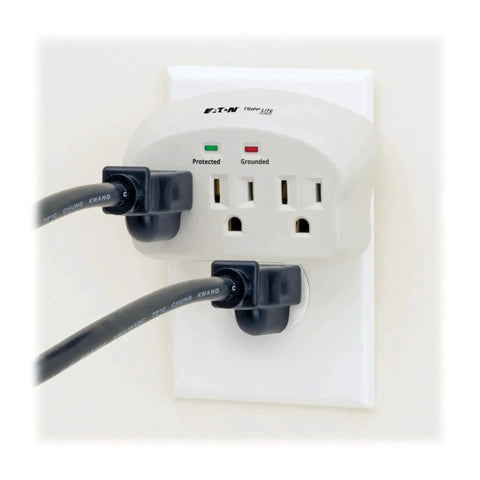 Three Outlet Travel Surge Protector On The Go With 660 Joules Ultra Fast Sub Nanosecond Response Diagnostic LEDs For Protected And Grounded UL Listed Portable Wall Plug Lifetime Warranty And Five Thousand Dollar Insurance, shown installed on wall with cords plugged in.