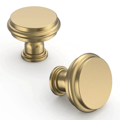 Two champagne bronze cabinet knobs from 10 Pack Champagne Bronze Cabinet Knobs for Kitchen Cabinets and Dressers, Zinc Hardware with Rust Proof Finish, 1.2 Inch Diameter and 1.1 Inch Height, Includes 1 Inch Screws