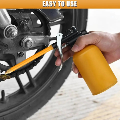 Person using Metal Oil Can With Straight And Flexible Spout 250ml Pistol Pump Oiler for Cars Bikes and Machines near bike chain