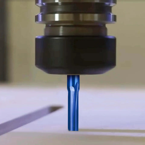 Close-up of Pro Grade CNC Router Bits Straight Router Bit One Eighth Inch Shank Two Flute End Mill Cutter in use on wood.
