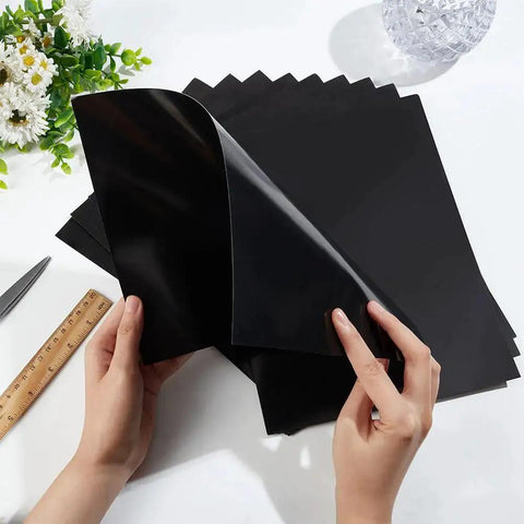 Double Sided Black Laser Test Paper For Fiber Laser Marking And Engraving Pro Grade Eleven By Eight Point Three Inches A4 Size Ten Sheets Thick Zero Point Two Millimeter For Precise Proofs And Fine Tuning Of Laser Engraving Machines BENECREAT shown with hands, flowers, and a ruler