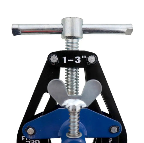 Close-up of PDQ 1220 Small Pipe Clamp For One To Three Inch Pipe Fitting Fit Up And Welding, showing adjustable parts with stainless tips.