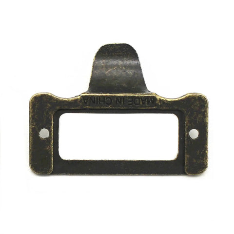 Front view of a single antique iron cup pull handle, bronze tone finish with subtle label frame card holder style.