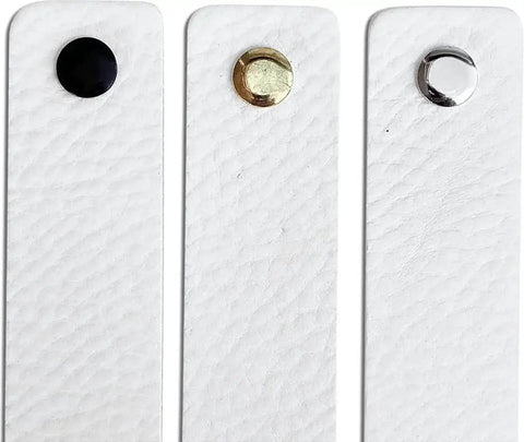 Three white leather drawer pulls with black, gold, and silver buttons, part of the Two Pack White Leather Drawer Pulls For Industrial Style Furniture Upgrade.