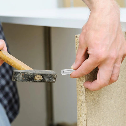 Person installing 100 Pcs 304 Stainless Steel Cylindrical Locating Pins 5x40mm Solid Dowel Pins in wooden frame for alignment.