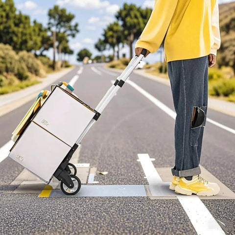 Person using Folding Hand Truck Dolly Cart With Telescoping Handle From 24 To 39 Inches on road with boxes, lightweight aluminum frame