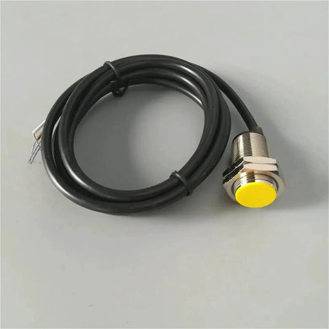 Amazon NPN M18 proximity sensor with yellow sensing face, metal threaded body and attached black cable