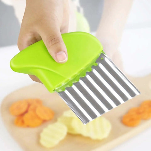 Hand holding 2 Pack Crinkle Cutter Wavy Chopper Stainless Steel Kitchen Slicer For Potatoes Carrots Fries Chips Vegetables Durable Rust Resistant Blade With Ergonomic Soft Grip Handle And Easy Cleanup slicing vegetables