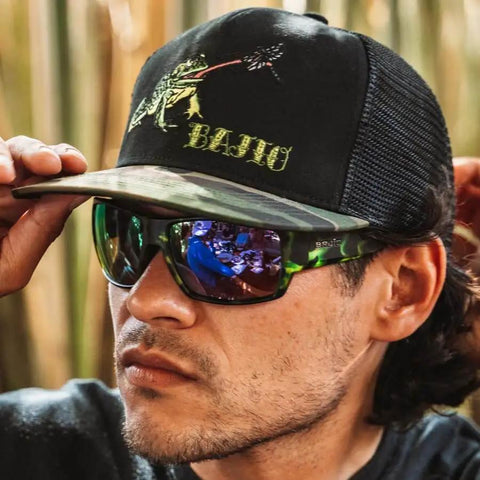 Man wearing Vega Polarized Sunglasses with Green Mirror Glass Lenses, Brown Tortoise Matte Frame, ideal for fishing.