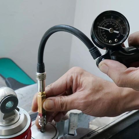 NICECNC nitrogen needle kit with brass needle head and pressure gauge connected to a shock inflator