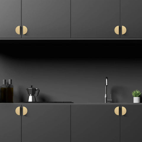 Solid Brass Cabinet Pulls 5 Pack Gold Half Moon Drawer Handles on black kitchen cabinets with brushed brass finish.
