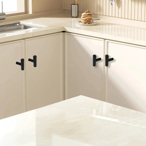 Six Pack 2 Inch T Bar Cabinet Knobs In Brushed Nickel Finish installed on white kitchen cabinets.