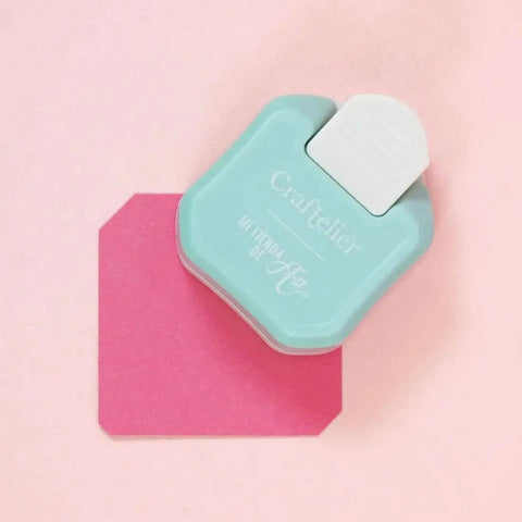 3 In 1 Corner Rounder Punch For Scrapbooking And Card Making With Three Radius Settings in blue next to pink paper sample