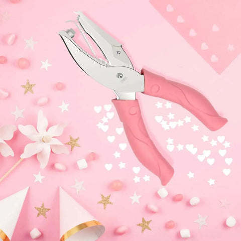 Heart And Star One Quarter Inch Metal Handheld Paper Punch Set With Soft Handled Design on pink background with stars and hearts