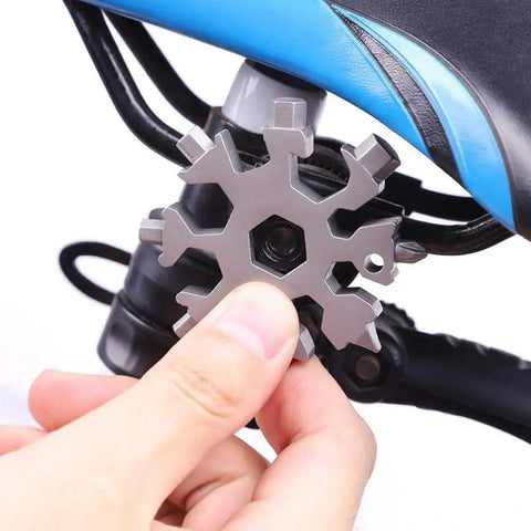 18 In 1 Snowflake Multi Tool In Stainless Steel For Everyday Carry Bottle Opener Slotted And Phillips Screwdrivers Box Cutter Rope Cutter Keyhole Tool Alloy Allen And Hex Wrenches In SAE And Metric Perfect Stocking Stuffer For Men shown with bicycle application
