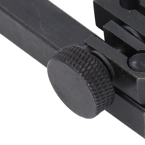 Close-up view of knurled adjustment knob on a black metal dial test indicator height holder clamp