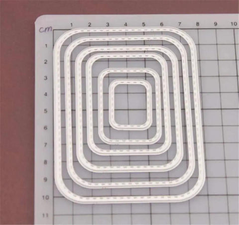 Rectangular Cutting Die Set for card making and scrapbooking on a grid, featuring 6 metal die cuts for albums and crafts.