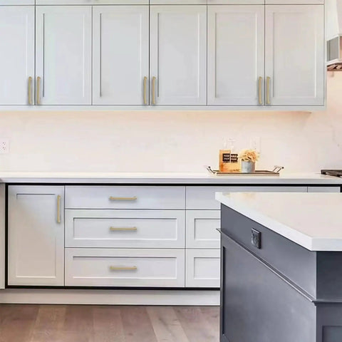 Modern kitchen with 10 Pack 5 Inch Champagne Bronze Cabinet Pulls on white drawers and cupboards, showcasing sleek design and quality.
