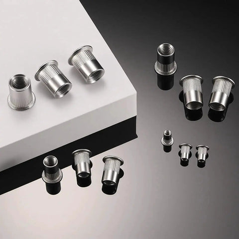 60Pcs M6 Stainless Steel Rivet Nuts Kit Flat Head Rivnut Threaded Inserts Nutsert Rivet Nut With Knurled Body displayed on surface