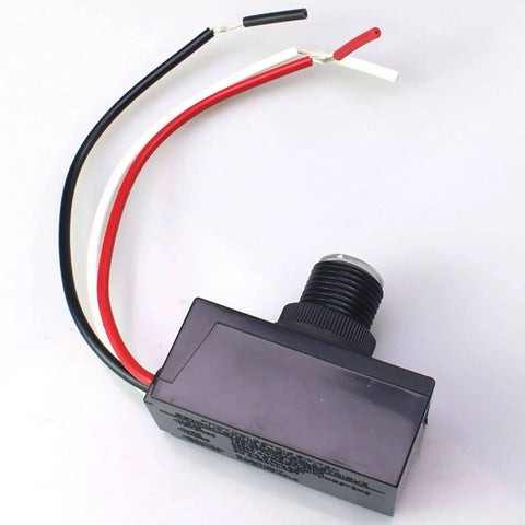 Outdoor Dusk To Dawn Sensor Switch with weatherproof plastic casing and copper conductor, wires exposed, shown from above