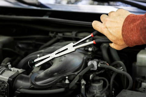Using Double-X External Snap Ring Pliers For Tight Spaces With Extra Reach And Jaw Opening Wider Than The Handles, Built With A Compound Joint For Confined Areas, Pro Grade Durability, Model 82033 in a car engine.