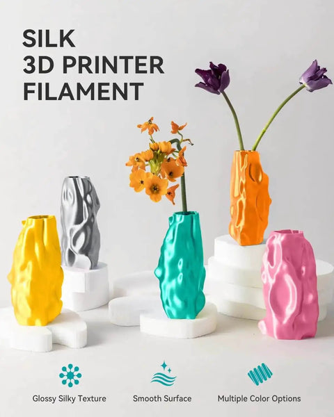 Colorful vases made from Silk PLA Filament 1.75mm For 3D Printers, Ultra Gloss Silk Finish, displayed on white pedestals.