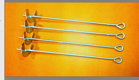 Half Inch By Thirty Inch Screw Anchor Set With Four Inch Helix Pack Of Four Galvanized Anchors for storage buildings laid on orange background