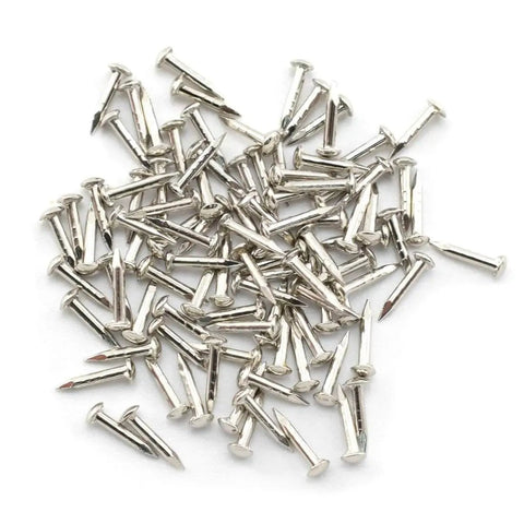 Close-up of pile of 96 nails included in Miniature Brass Hinges Set For Jewelry Boxes And Cabinets 24 Pieces 10 By 8 Millimeter 180 Degree Rotation Silver Finish Includes 96 Mounting Nails Durable Rust Resistant Hardware For DIY Projects Easy To Install
