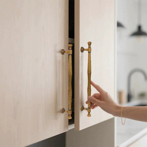 Antique Brass Cabinet Pulls 5 Inch Center To Center Zinc Alloy Solid Drawer Handles for Bedroom and Kitchen installed on light wood cabinet