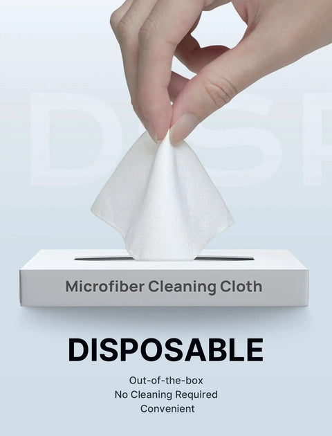 Hand pulling disposable microfiber cleaning cloth from a box labeled 'Microfiber Cleaning Cloth Pack 100 For Glasses Screens Cameras Phones Switch'.