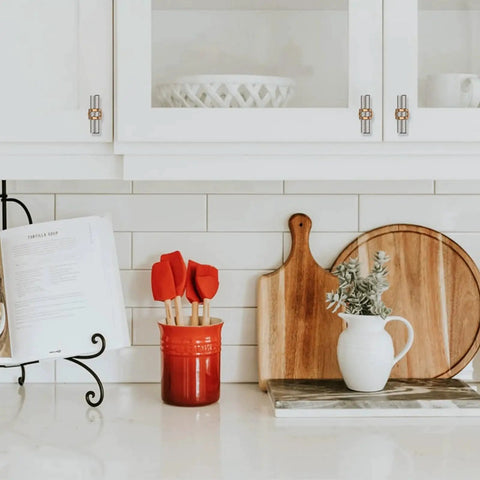 Kitchen cabinets with 10 Pack Brushed Satin Nickel And Champagne Bronze Cabinet Knobs Set, shown installed in a modern kitchen setup.