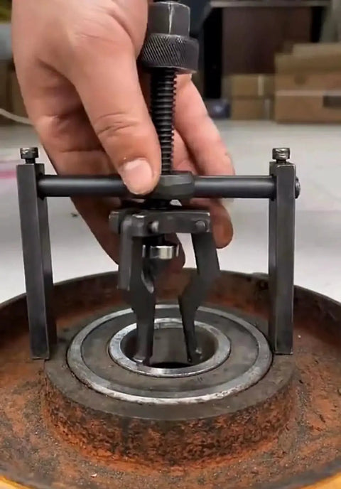 Inner Hole Bearing Puller With Three Claw Design for precise bearing removal in automotive repair, shown extracting bearing from hub.