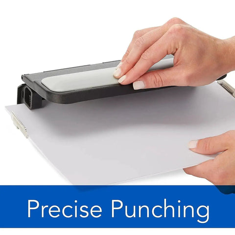 Hands using Heavy Duty 2 To 7 Hole Punch With Adjustable Head and Easy Touch Handle, punching paper, black and gray metal construction
