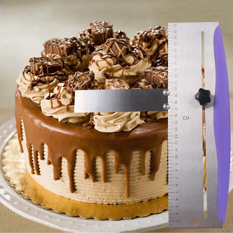 Cake Scraper And Leveling Tool Set Stainless Steel With PP Handle Adjustable Frosting Spatula Pro Grade next to a chocolate cake