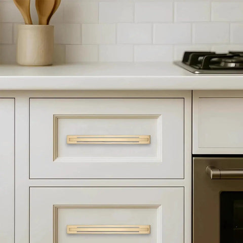 5 Pack 5 Inch Center To Center Champagne Bronze Cabinet Pulls With Matching Backplates installed on white kitchen drawers
