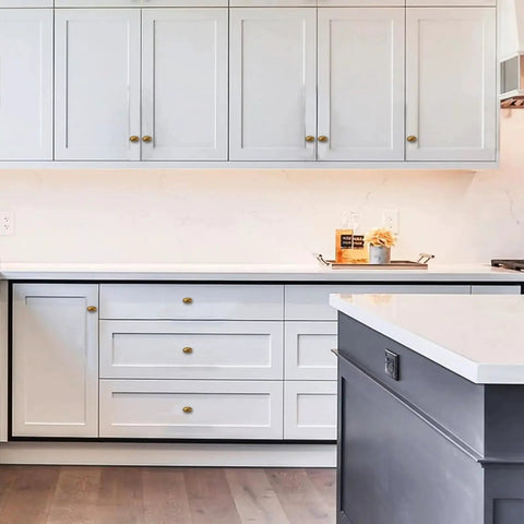 Modern kitchen with white cabinets featuring 10 Pack Antique Brass Cabinet Knobs Made From High Quality Metal Solid Heavy Duty Oval Cupboard Drawer Hardware.