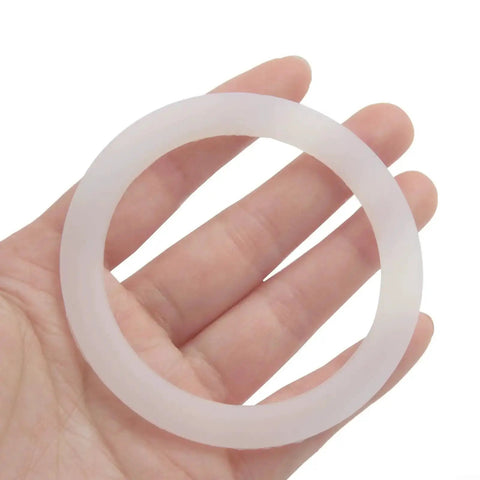 Silicone Gasket Seal For Coffee And Espresso Moka Pot Stove Top O Ring Replacement With Flexible Inner Diameters 39 42 50 54 63 73 Mm Fits 1 Cup To 12 Cup Moka Express Pots White held in hand