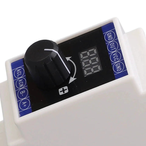 Close-up of adjustable 0 to 22 milliamp current signal simulator with 3-digit display for PLC debugging rail mount analog generator.