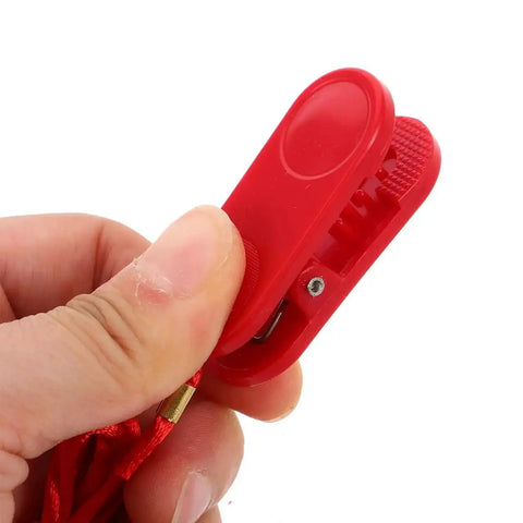Close-up of red Replacement Treadmill Safety Key and Emergency Stop Clip for fitness equipment with dual insert design