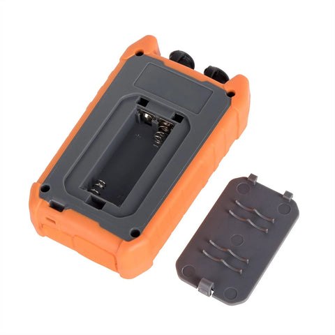 Optical power meter, orange and gray handheld with open battery compartment; gray cover beside