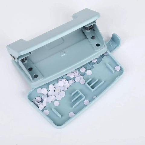 Heavy Duty Metal Two Hole Punch For A4 A5 B5 Paper shown open with chip tray filled, blue, 10 sheet capacity, office workhorse.
