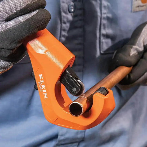 Person using Constant Swing Workhorse Tubing Cutter For Copper And Aluminum One Eighth To One And Three Eighths Inch Outside Diameter.