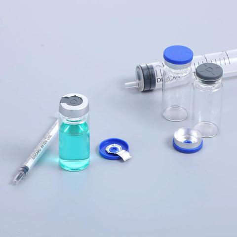 Sibba 10 Pcs glass injection vials, 5ml empty vials with blue/gray caps; syringe and turquoise liquid bottle present.