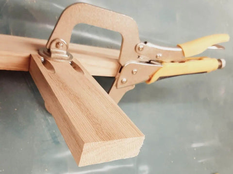 Side view of Three And A Half Inch Open Depth Quick Release Face Frame Clamp Workhorse With Extra Large Pad For Pocket Hole Jig Assembly Ideal For Cabinet Face Frames Boxes And Picture Frames Model 81934 clamping wood.