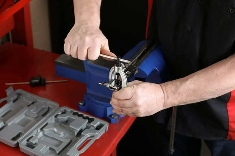 Using Heavy Duty Double Flaring Tool Set With Extra Adapters For Copper Aluminum Soft Steel Brake Lines And Brass Tubing in a workshop