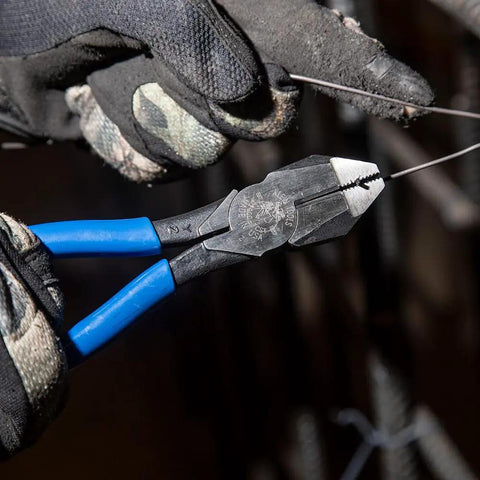 Heavy Duty Slim Head Diagonal Cutters With Spring Loaded Action For Cutting ACSR Nails Screws And Soft Rebar Tie Wire Induction Hardened Blades For Longevity Forged In USA Ironworker Pliers From Klein Tools being used on wiring