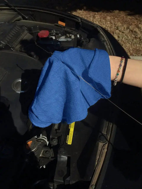 Blue cotton towel from 150 Pack Cotton Shop Towels 14 By 12 Inches Absorbent Rags For Auto Shops used for engine wipe down