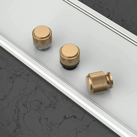 Front view of Matte Black And Champagne Bronze Kitchen Cabinet Knobs Set Of 10 for dresser drawers zinc knobs on table surface.