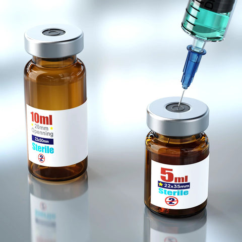 Sterile empty amber glass vials with aluminum caps; two vials (10 ml and 5 ml) with syringe entering the injection port