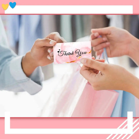 Hands exchanging a thank you card, linked to the Heart Shaped Handheld Punch Card Kit With 100 Reward Cards, home office use.